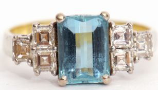 Aquamarine and diamond ring, the emerald cut aquamarine in a four claw setting between six square