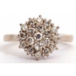 Diamond cluster ring, the three tiers of brilliant cut diamonds all in a basket mount, stamped 18ct,