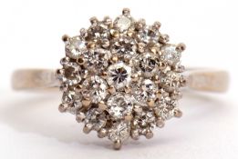 Diamond cluster ring, the three tiers of brilliant cut diamonds all in a basket mount, stamped 18ct,