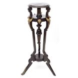 19th century ebonised and gilt metal mounted tochere stand, upper tier over a parcel gilded column