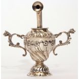 Unusual Victorian silver encased table lighter of trophy cup design, wrythen embossed, crimped