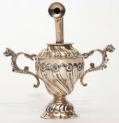 Unusual Victorian silver encased table lighter of trophy cup design, wrythen embossed, crimped