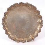 Late Victorian small salver with beaded and scrolled edge, foliate bright cut centre with vacant