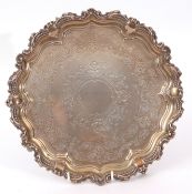 Late Victorian small salver with beaded and scrolled edge, foliate bright cut centre with vacant