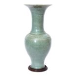 Chinese Longquan celadon vase, possibly Ming dynasty, of elongated pear shaped form with moulded