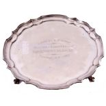 Elizabeth II waiter of shaped circular form with a pie-crust edge and supported on four claw and