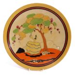 Clarice Cliff plate in the Idyll type pattern with a lady in flounced skirt below balloon like