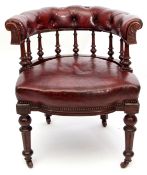 Mid-late Victorian stained oak and red ox-blood leather upholstered bow back armchair, nine turned