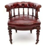 Mid-late Victorian stained oak and red ox-blood leather upholstered bow back armchair, nine turned