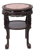 Burmese profusely carved padouk wood urn stand of shaped circular form, the top with beaded and