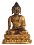 Fine Tibetan Chinese Buddha of Shakayamuni, heavily gilded with inscription to base, 11cm high