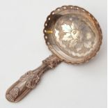 George III caddy spoon with shell embossed and prick engraved hollow handle, the oval bowl with