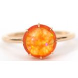 Fire opal ring, the circular cabochon fire opal multi-claw set and raised in a plain polished