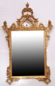 Large gilded overmantel mirror of rectangular form, C scroll surround and further floral detail