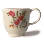 Lowestoft porcelain coffee cup circa 1775, with a tulip painter type design in polychrome