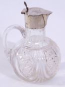 Late Victorian cut glass claret jug with solid looped handle having a plain silver collar and hinged