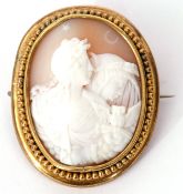 Victorian carved oval shell cameo brooch depicting day and night, in a gilt beaded frame, 5 x 4cm