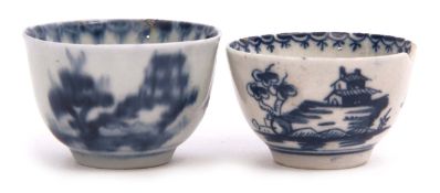 Two miniature Lowestoft tea bowls decorated with a blue and white design below a berry border (