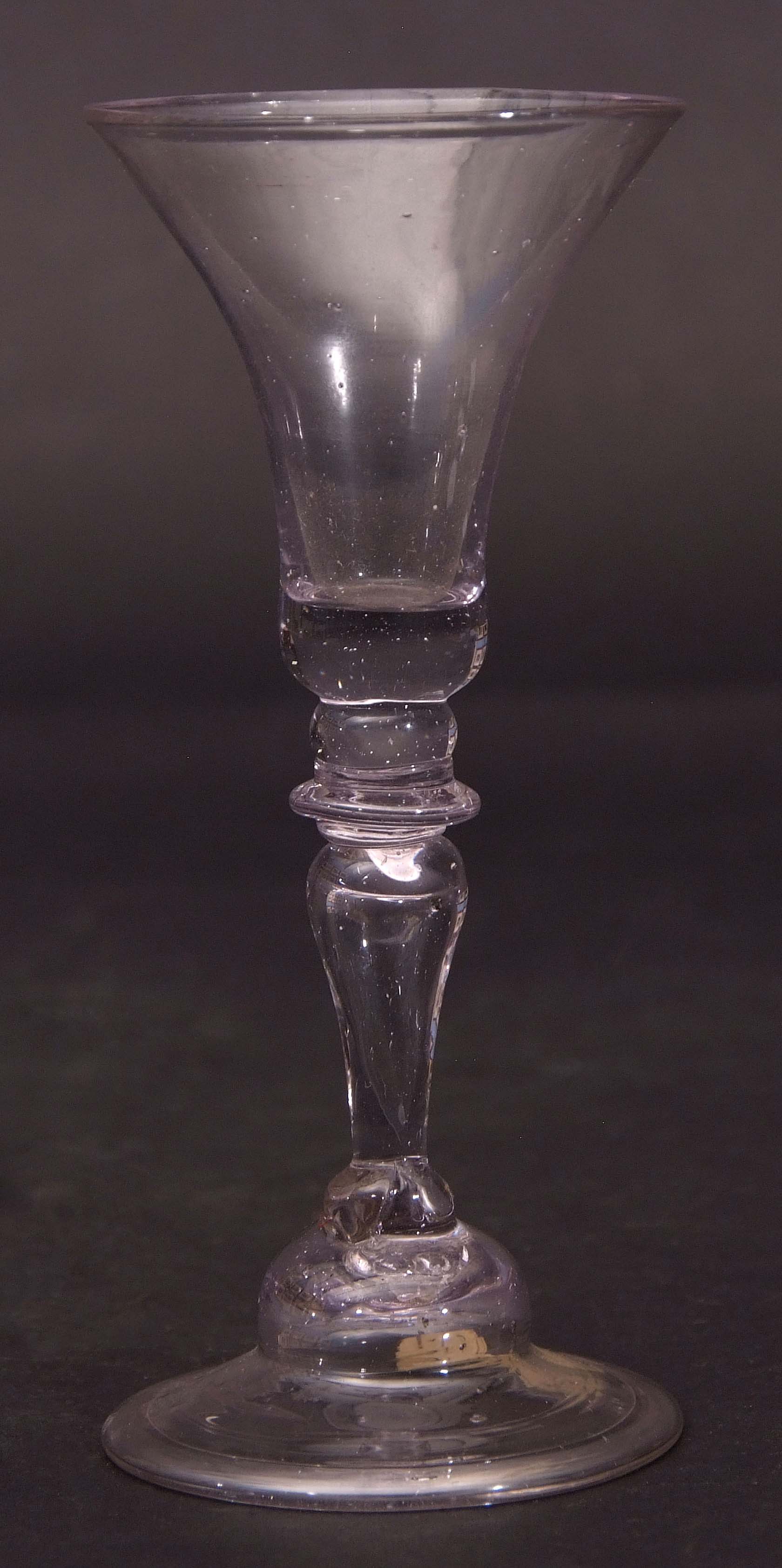 Mid-18th century wine glass, the bell bowl above a single knop stem, 16cm high