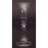 Mid-18th century wine glass, the bell bowl above a single knop stem, 16cm high