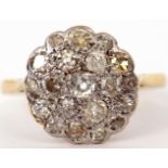 Diamond cluster ring, the circular panel set with 19 mixed cut diamonds, all in a basket setting,