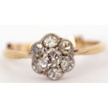 Precious metal diamond cluster ring, the principal diamond 0.15ct app, raised within a surround of