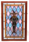 19th century/20th century mahogany framed leaded coloured glass panel of a jester, overall size