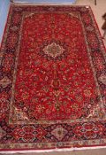 Fine modern Keshan carpet, triple-gull border, central panel of twining foliage, mainly red and blue