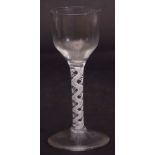 Mid-18th century wine glass with ogee bowl above an air twist stem, 17cm high