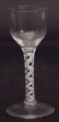 Mid-18th century wine glass with ogee bowl above an air twist stem, 17cm high