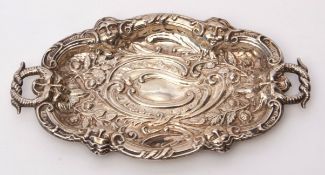 Late Victorian small dressing table tray of shaped oval design with serpent formed handle,