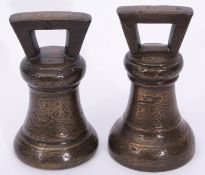 Two early 19th century bronze bell shaped 14lb weights, each 19cm high