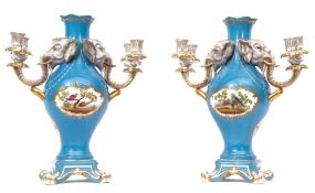 Pair of ornate Herend two-branch and four sconce candelabra, each with elephant mask mounts and