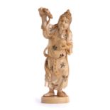 Ivory model of a Japanese or Chinese diety holding a dragon in one hand and orb in the other, 17cm