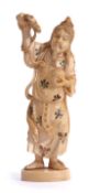 Ivory model of a Japanese or Chinese diety holding a dragon in one hand and orb in the other, 17cm