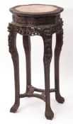 Burmese profusely carved padouk wood jardiniere or bust stand, the shaped circular top with carved