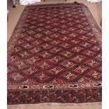 Early 20th century Yomut carpet decorated with the Dyrnak Guls design, the central panel with