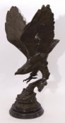 After Moignez, Green patinated cast metal study of an eagle with outstretched wings perched on an