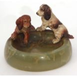 Green onyx ashtray applied with two cold painted bronze models of dogs in the manner of Bergman,