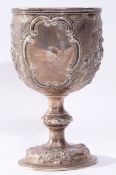 Large Victorian presentation goblet, the cup top heavily chased and embossed with floral and foliate