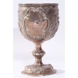 Large Victorian presentation goblet, the cup top heavily chased and embossed with floral and foliate