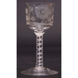 Jacobite wine glass, the funnel bowl with typical engraved decoration above an air twist stem,