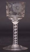 Jacobite wine glass, the funnel bowl with typical engraved decoration above an air twist stem,