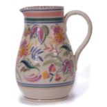Large Poole Pottery jug with strap handle, the baluster body decorated with a leaf and floral