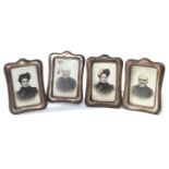 George V set of four shaped rectangular silver mounted easel back photograph frames with embossed