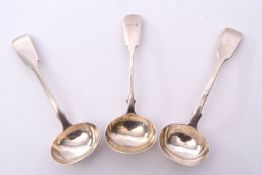 Group of three Victorian sauce ladles in Fiddle pattern with oval bowls, one bearing a crest,