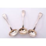Group of three Victorian sauce ladles in Fiddle pattern with oval bowls, one bearing a crest,