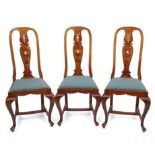 Set of six early 20th century walnut dining chairs, the arched tops with vase shaped splat backs,