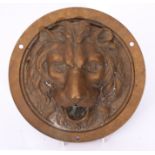 Unusual cast bronze mount, A Pandiani, Milano, of circular form in the form of a lion mask, 23cm