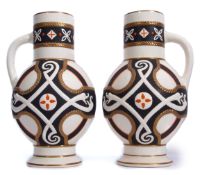 Pair of late 19th century vases decorated in an aesthetic fashion with snakes on a black ground